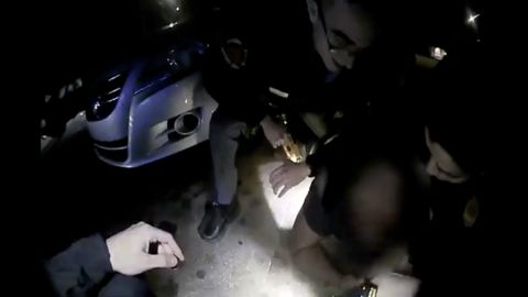 In this screen capture from a video camera released by the Raleigh Police Department, police officers place Darryl Tyree Williams on the ground.