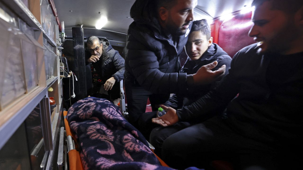The body of Palestinian Mithkal Suleiman Rayan is transported in an ambulance, in the town of Qarawat Bani Hassan in the occupied West Bank province of Salfit, on February 11, 2023.