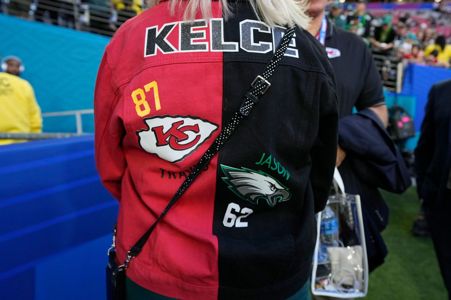 Donna Kelce, the mother of Travis and Jason Kelce, wears a jacket showing support for both of her sons' teams.