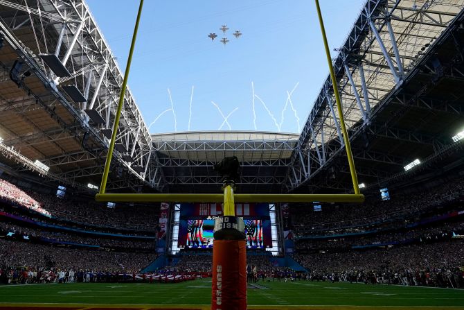 US Navy jets fly over State Farm Stadium before the start of the game. For the first time ever, the ceremonial act <a href="index.php?page=&url=https%3A%2F%2Fwww.cnn.com%2F2023%2F02%2F10%2Fsport%2Fall-women-flyover-super-bowl-lvii-spt-intl%2Findex.html" target="_blank">was performed by an all-women crew</a>.