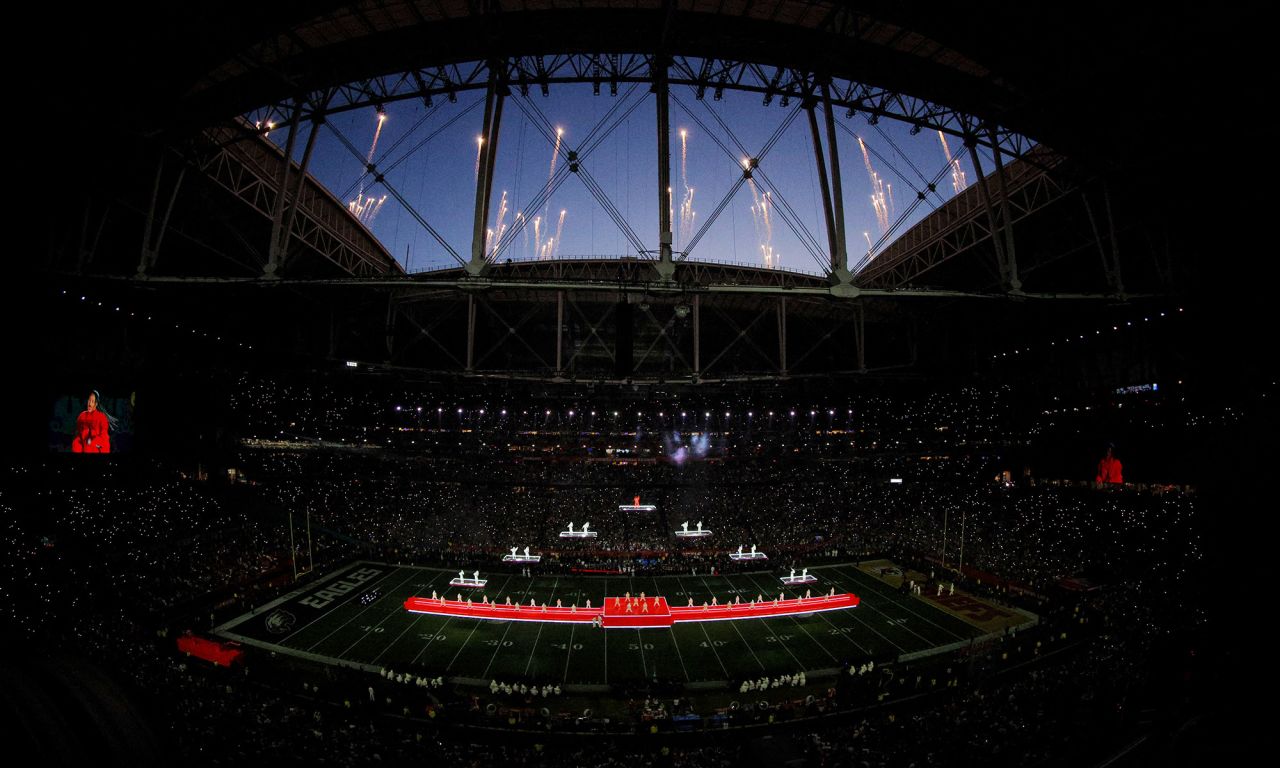 Fireworks go off over the stadium during the performance.