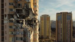 TOPSHOT - This general view shows damage to the upper floors of a building in Kyiv on February 26, 2022, after it was reportedly struck by a Russian rocket. - Russia on February 26, 2022 ordered its troops to advance in Ukraine "from all directions" as the Ukrainian capital Kyiv imposed a blanket curfew and officials reported 198 civilian deaths. Kyiv residents took shelter to the sound of explosions as Ukraine's army said it had held back an assault on the capital but was fighting Russian "sabotage groups" which had infiltrated the city. (Photo by Daniel LEAL / AFP) (Photo by DANIEL LEAL/AFP via Getty Images)