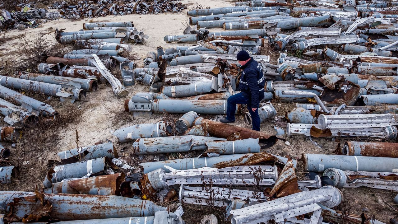 An expert from the prosecutor's office examines collected remnants of shells and missiles used by the Russian army to attack the second largest Ukrainian city of Kharkiv, on Decmber 7. 