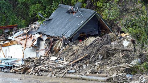 A storm-damaged house inTitirangi, a suburb of New Zealand's West Auckland area, on February 13, 2023. 