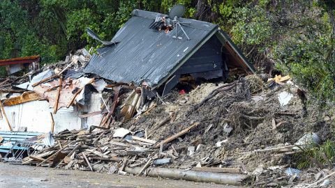 A storm-damaged house inTitirangi, a suburb of New Zealand's West Auckland area, on February 13, 2023.