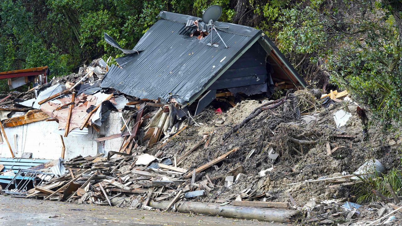 A damaged house is wrecked after a cyclone battered Titirangi, a suburb of New Zealand's West Auckland area, on February 13, 2023. 