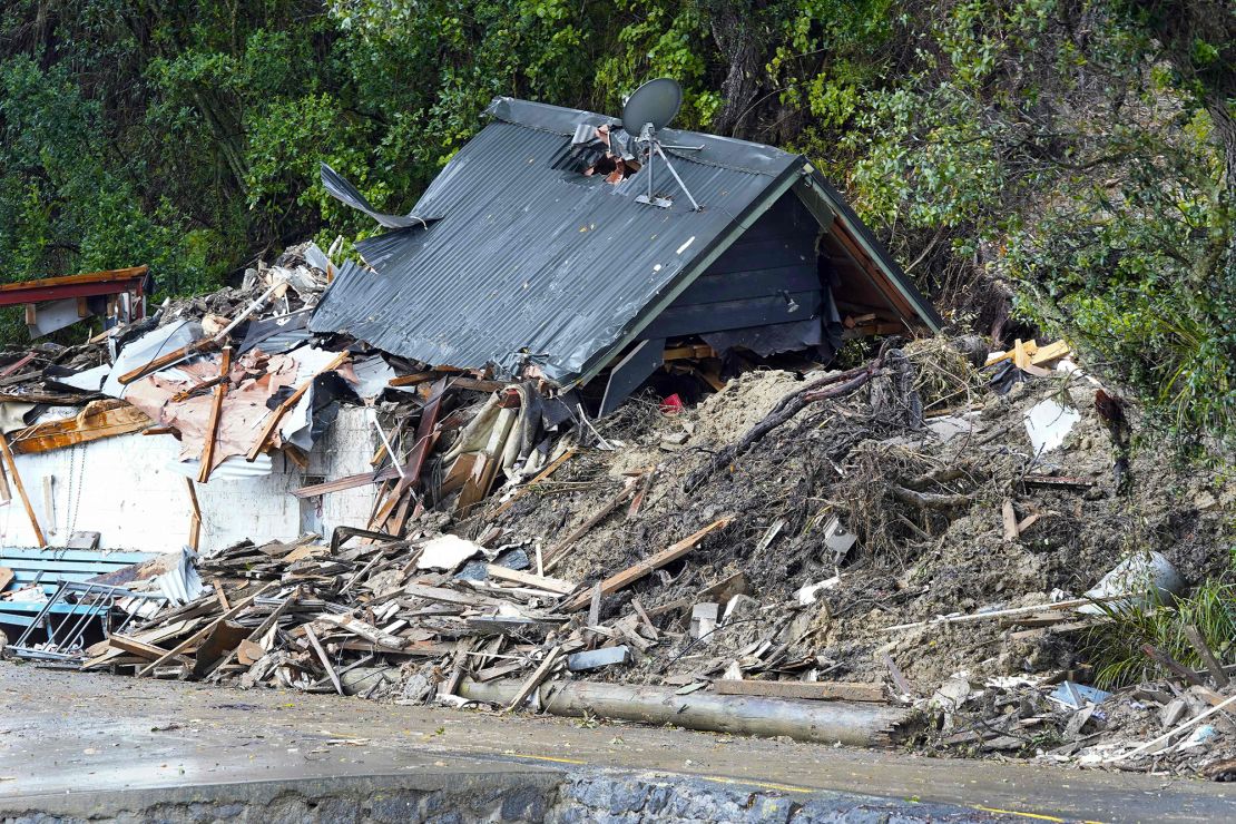 A damaged house is wrecked after a cyclone battered Titirangi, a suburb of New Zealand's West Auckland area, on February 13, 2023. 