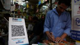 A QR code of Paytm is seen at a mobile repairing shop in Kolkata, India, November 9, 2021. 