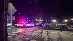 Police and emergency vehicles sit on Michigan State University's campus as police search for an active shooter on Mon., Feb. 13, 2023.