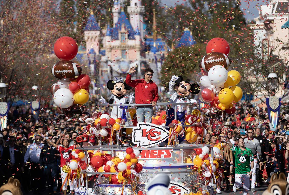 Mahomes celebrates his team's Super Bowl LVII triumph with a victory parade down Main Street alongside Mickey Mouse and Minnie Mouse at Disneyland Park.