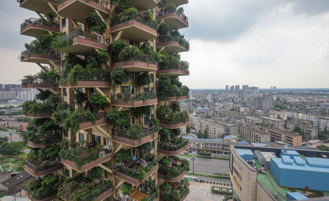 An apartment block with balconies full of plants at a residential community in Chengdu in China's southwestern Sichuan province pictured on July 12, 2021