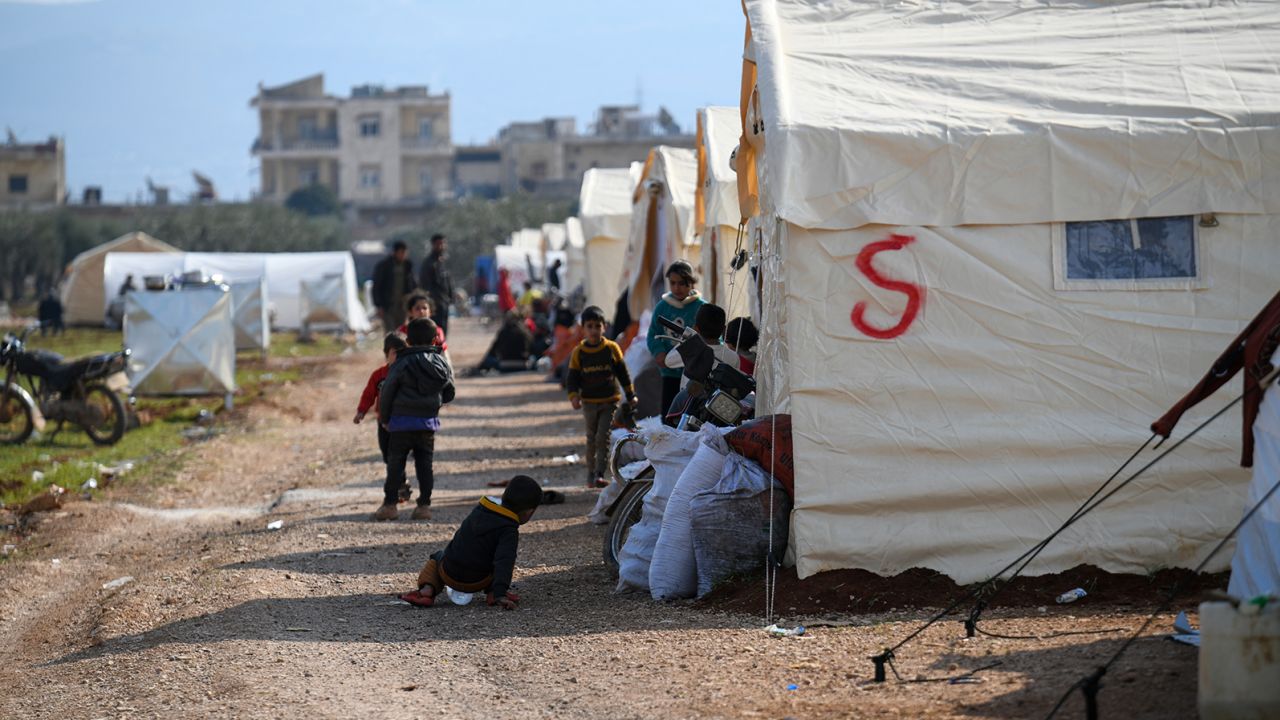 People displaced by the earthquake take refuge in shelters and temporary camps on the outskirts of Jenderes, northwest Syria, on Monday.