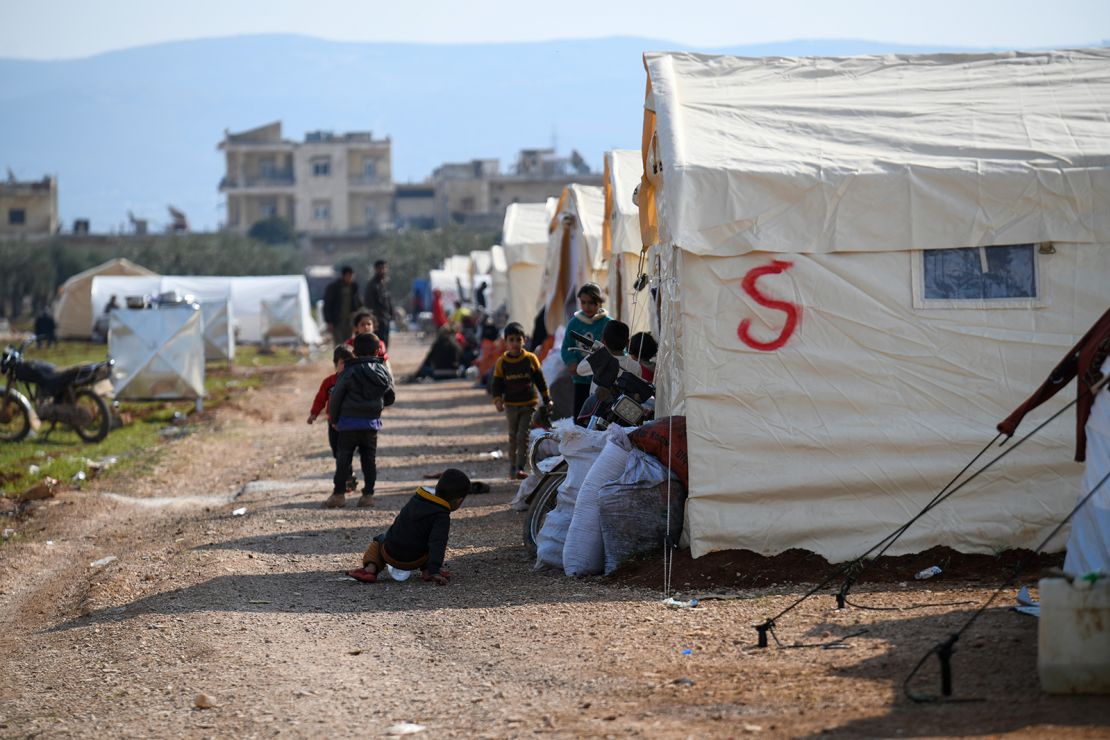 People displaced by the earthquake take refuge in shelters and temporary camps on the outskirts of Jenderes, northwest Syria, on Monday.