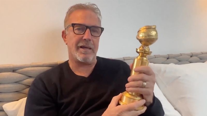 Kevin Costner finally got to hold his Golden Globe after missing the show due to flooding | CNN