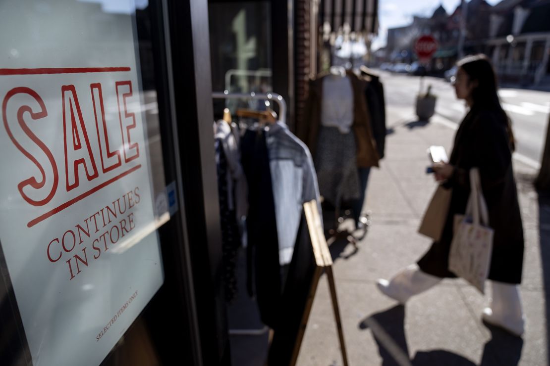 A shop holds a sidewalk sale during an unseasonably warm day, Friday, Feb. 10, 2023, in Providence, R.I. 