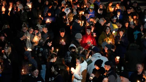 Mourners attend a candlelight vigil for Alexandria Verner at the Clawson High School football field in Clawson, Michigan, February 14, 2023. 
