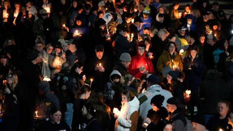 Mourners attend a candlelight vigil Tuesday for Alexandria Verner at Clawson High School.