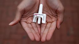 In this Jan. 23, 2018 photo, Leah Hill, a behavioral health fellow with the Baltimore City Health Department, displays a sample of Narcan nasal spray in Baltimore.  The overdose-reversal drug is a critical tool to easing America's coast-to-coast opioid epidemic. But not everyone on the front lines has all they need. Baltimore's health department is rationing its supplies of naloxone because it says it can't afford an adequate stockpile.  (AP Photo/Patrick Semansky)