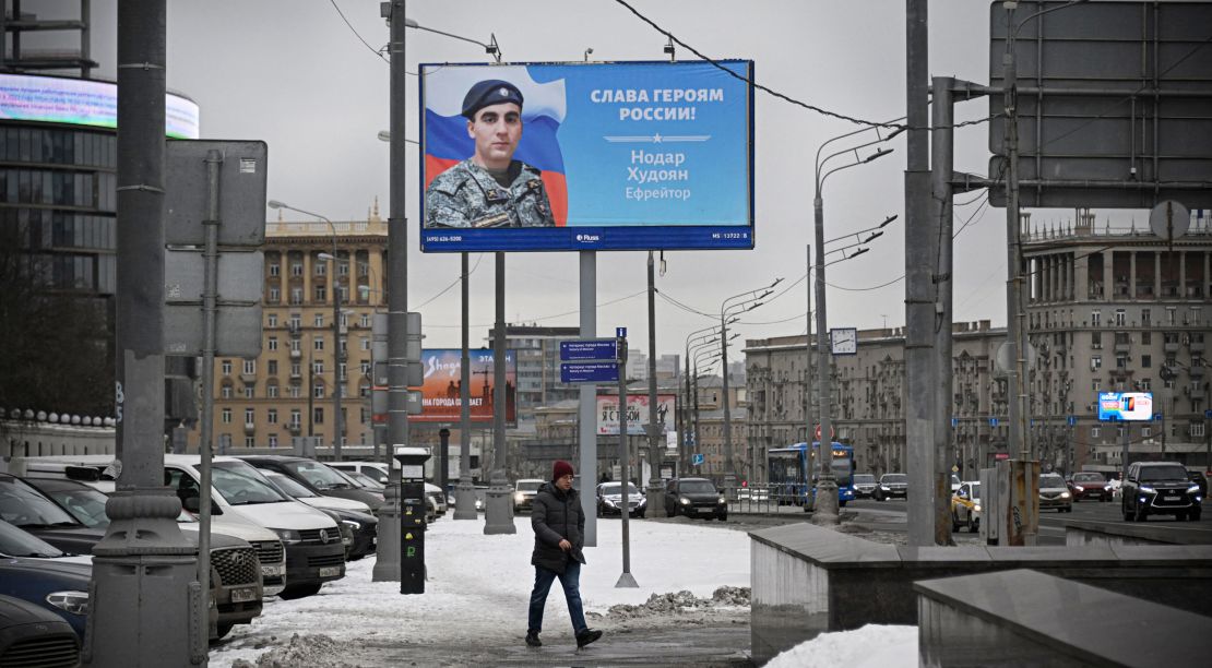A billboard displays the face of Specialist Nodar Khydoyan, who is participating in Russia's military action in Ukraine, in central Moscow on February 15, 2023. 