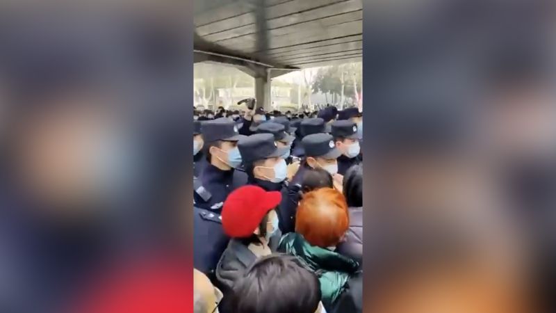 NextImg:Elderly protest health insurance cuts in China's Wuhan | CNN Business