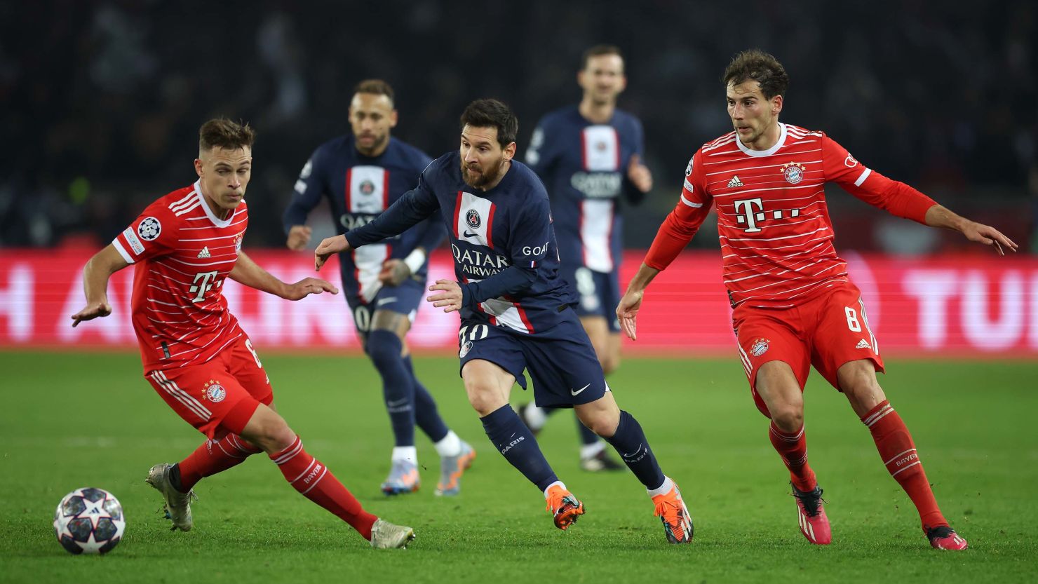 Lionel Messi tries to dribble past Joshua Kimmich (left) in PSG's defeat against Bayern Munich. 