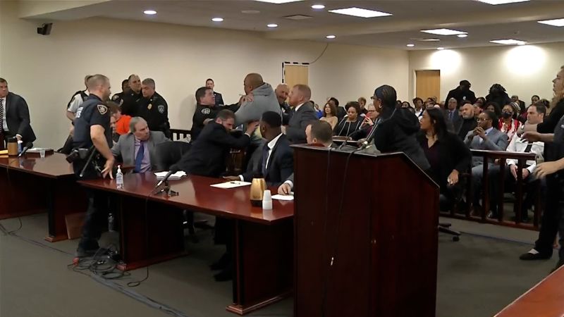 NextImg:Man rushes at Buffalo grocery store mass shooter during hearing | CNN