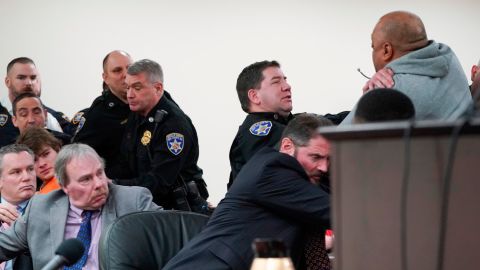 Assistant district attorney Gary Hackbush, bottom, helps deputies restrain a man who lunged toward Payton Gendron during the sentencing hearing on Wednesday.