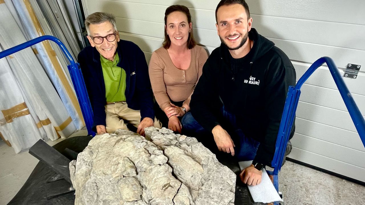 (From left) John Hudson, Marie Woods and Dean Lomax are shown with the dinosaur footprint.