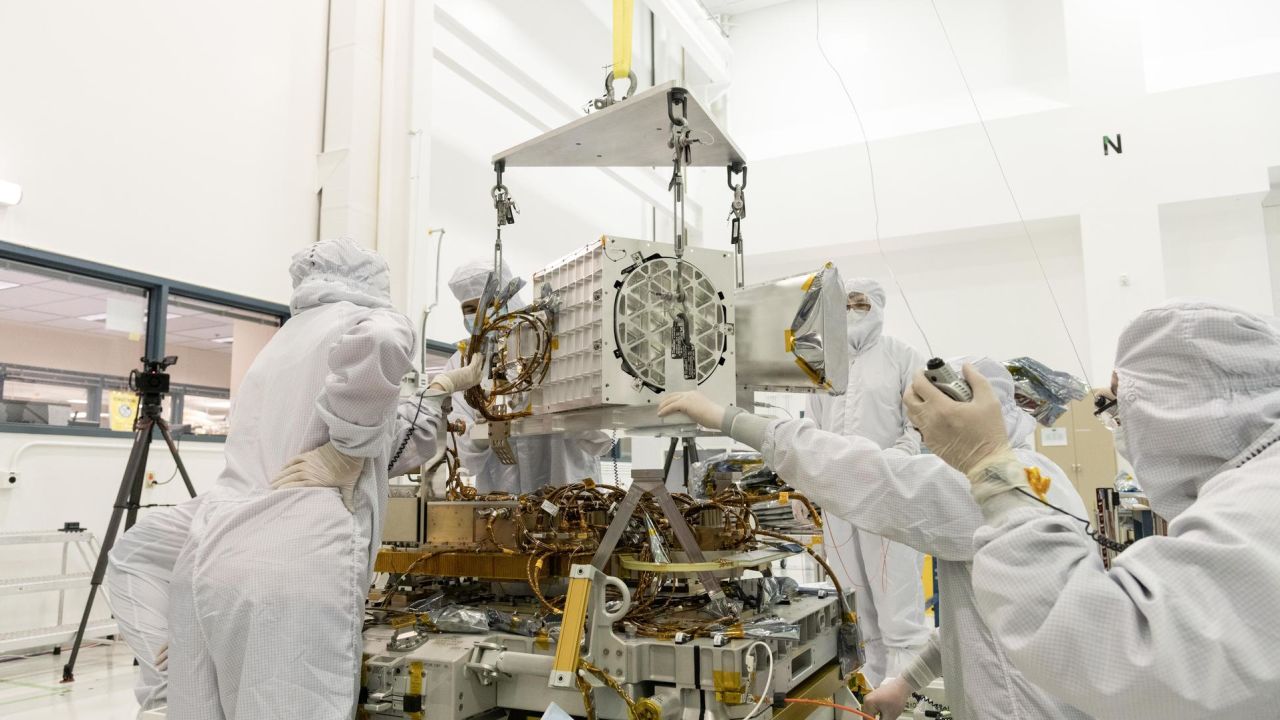 Engineers at NASA's Jet Propulsion Laboratory in California assemble components of the EMIT device in December 2021.