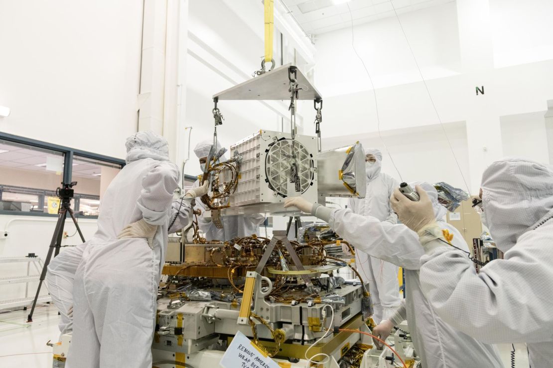Engineers at NASA's Jet Propulsion Laboratory in California assemble components of the EMIT device in December 2021.