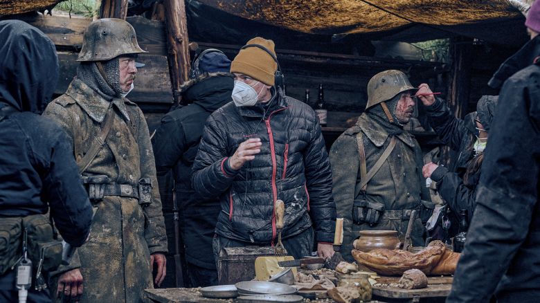 Actor Albrecht Schuch (left) and director Edward Berger (center) on location n the Czech Republic during the shoot of "All Quiet on the Western Front."