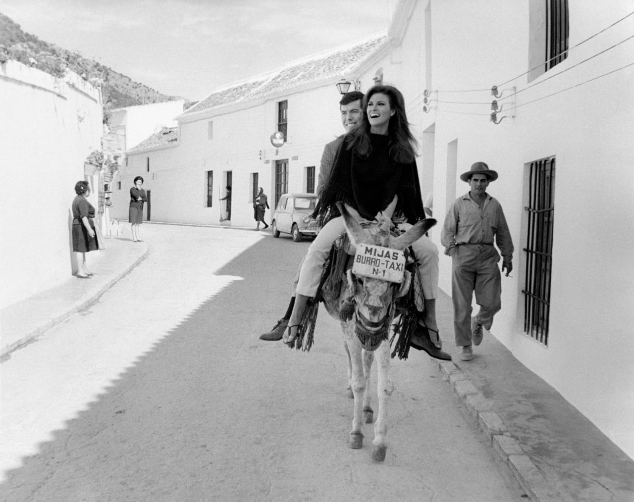 Welch rides a donkey in Malaga, Spain, with her boyfriend, film producer Patrick Curtis, in 1966. She was in Spain shooting the movie "Fathom." Welch and Curtis married the next year. Curtis was the second of Welch's four husbands.