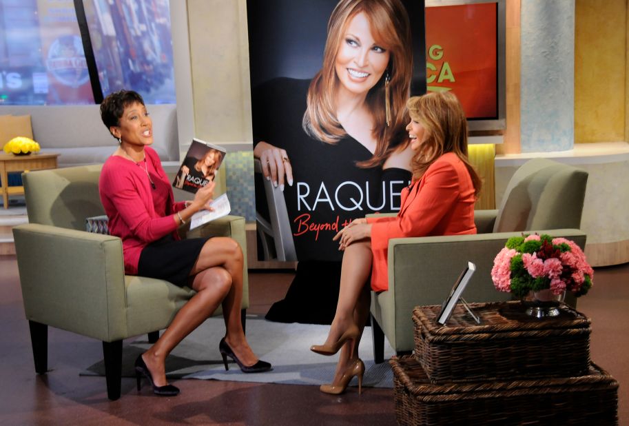 "Good Morning America" host Robin Roberts holds up a copy of Welch's autobiography, "Beyond the Cleavage," as they discuss the book in 2010.