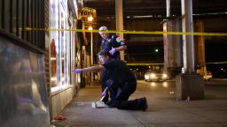 Police work a crime scene after two people were shot, one fatally, in Chicago on July 5, 2019.