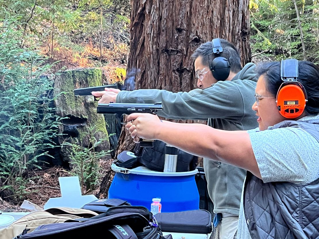 Chris Cheng and Trish Sargentini, in the foreground, practice at Cheng's private range.