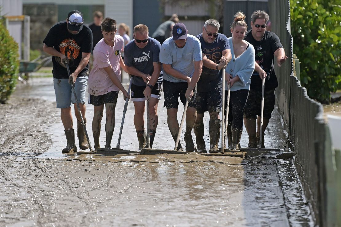 Residents clean up silt following flood waters on February 15, 2023 in Napier, New Zealand.