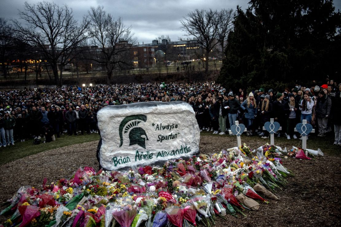 A makeshift memorial Wednesday at The Rock, a popular MSU landmark, honored the victims.