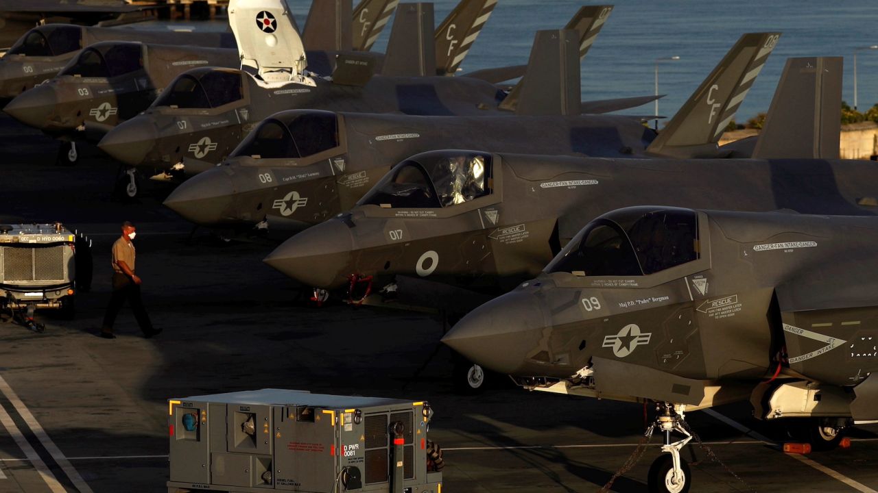 A row of Lockheed Martin F-35B Lightning II aircraft is seen onboard Britain's HMS Queen Elizabeth aircraft carrier at Changi Naval Base in Singapore on October 11, 2021. 
