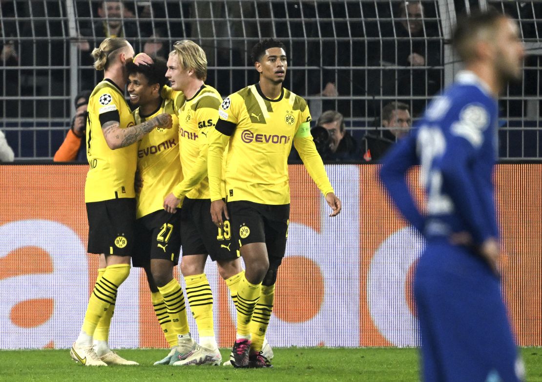 Adeyemi celebrates his goal against Chelsea with his Dortmund teammates. 