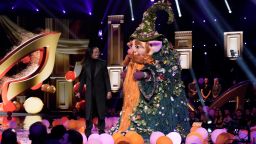 THE MASKED SINGER. L-R: Host Nick Cannon and Gnome in the season nine premiere episode of THE MASKED SINGER airing Wednesday, Feb.15 (8:00-9:00 PM ET/PT) on FOX. 