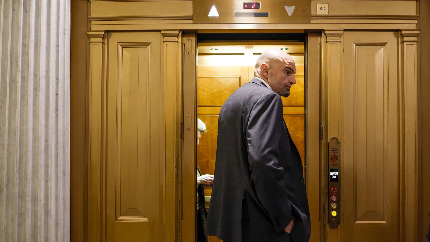 Democratic Sen. John Fetterman of Pennsylvania departs from the Senate Chambers during a series of the votes at the U.S. Capitol Building on February 13, 2023 in Washington, DC.