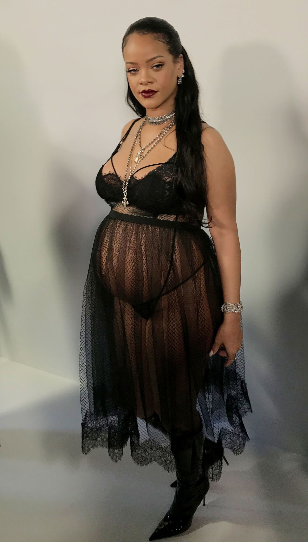 In her last trimester, Rihanna donned a lacy black bra and sheer skirt that revealed a tiny black thong while attending Dior's Fall-Winter 2022 show at Paris Fashion Week last year.