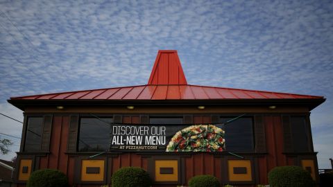 Pizza Hut's red-roof restaurants have come down, replaced by sleek new designs.