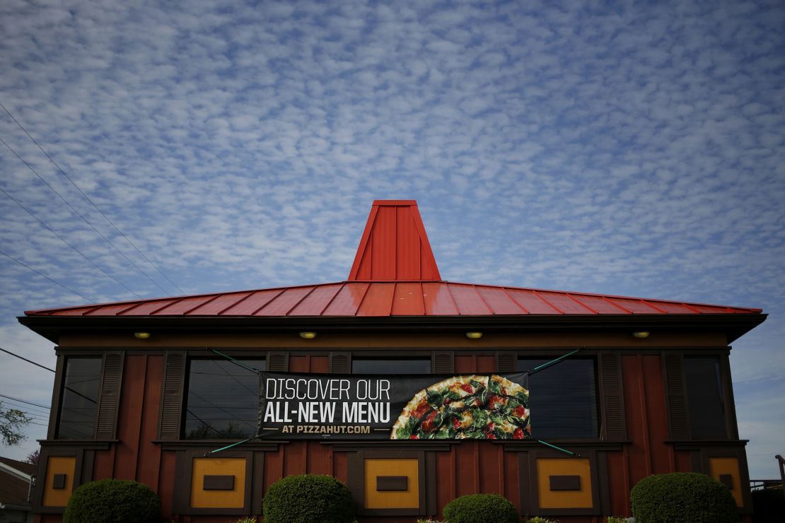 Pizza Hut's red-roof restaurants have come down, replaced by sleek new designs.