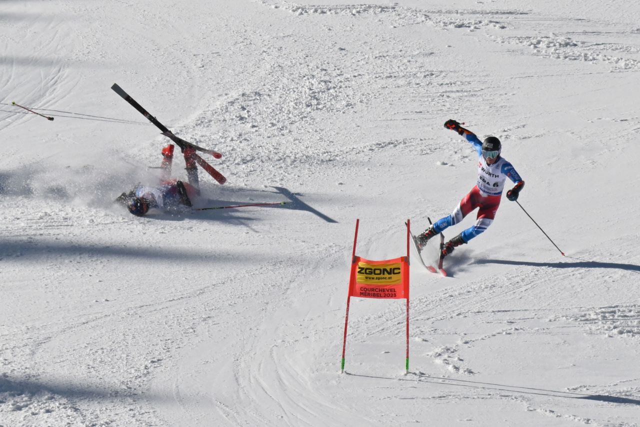 Slovakia's Martin Hyska, left, falls next to France's Alban Elezi Cannaferina as they competed in a parallel event at the Alpine Skiing World Championships on Tuesday, February 14.