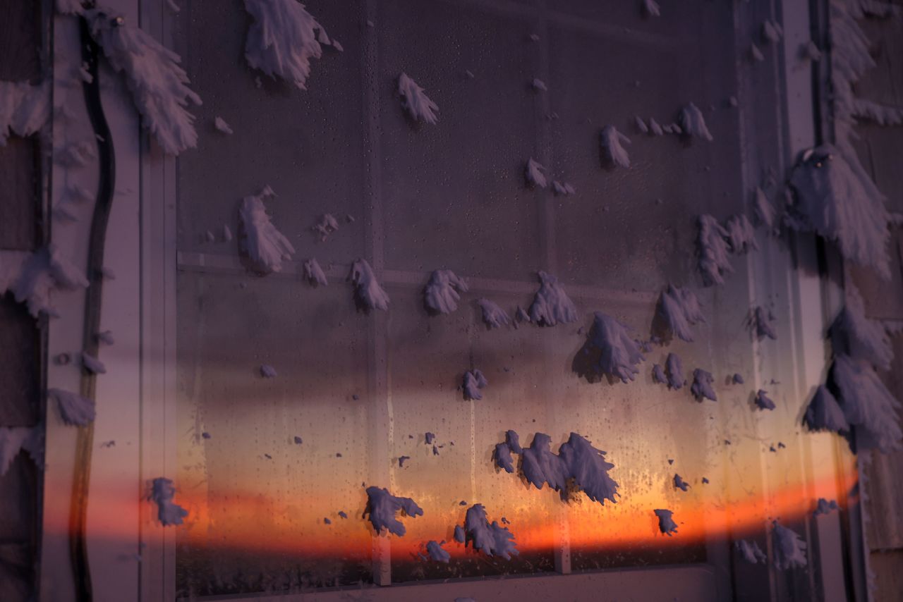 The sun illuminates a window speckled with ice at the top of New Hampshire's Mount Washington on Thursday, February 9. At just over 6,000 feet, the <a href="https://www.cnn.com/2023/02/06/weather/extreme-cold-mount-washington-wxn/index.html" target="_blank">Mount Washington Observatory</a> is situated in the perfect location for extreme winds and brutal cold. 