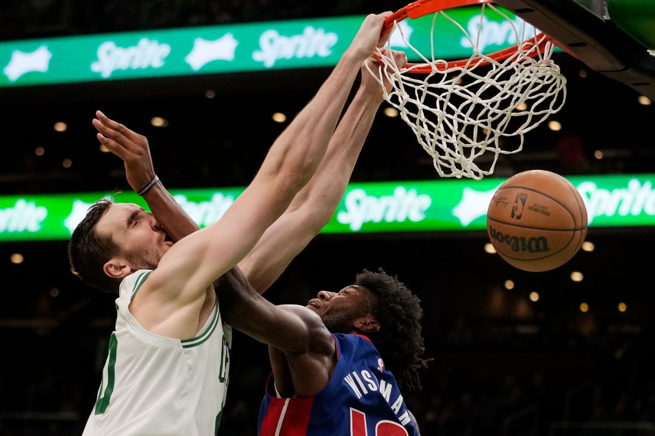 Boston Celtics center Luke Kornet slams the ball over Detroit's James Wiseman during an NBA basketball game on Wednesday, February 15.