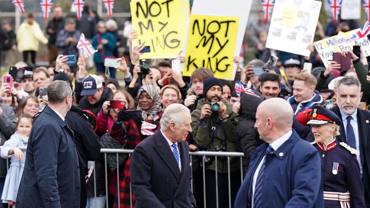 Demonstrators hold placards reading "Not My King" as King Charles III meets well-wishers in Milton Keynes, north of London, Thursday. 
