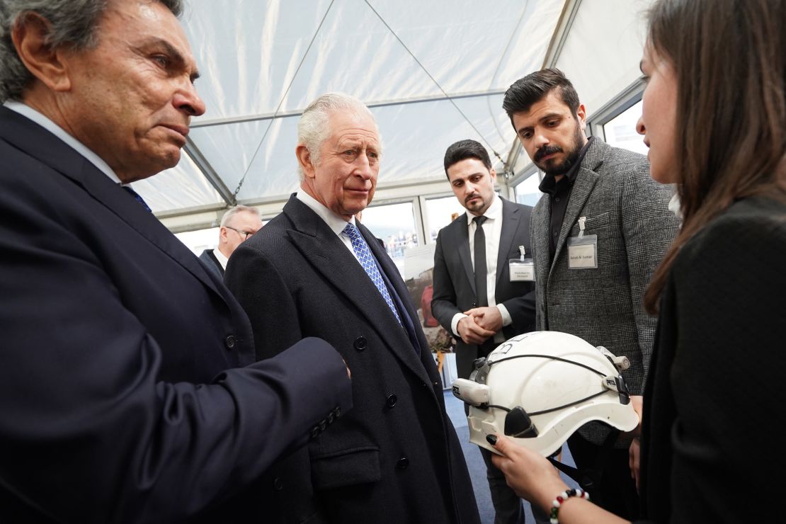 King Charles III is presented with a White Helmet from the Syria Civil Defence organisation as he talks with members of the Syrian diaspora community on Tuesday.