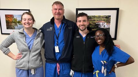 Seun Adebagbo, right, with the site director (second from left) and two peers on her last day of her surgery rotation. 